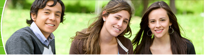 photo of collefe students sitting on grass