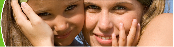 photo of woman and girl embracing