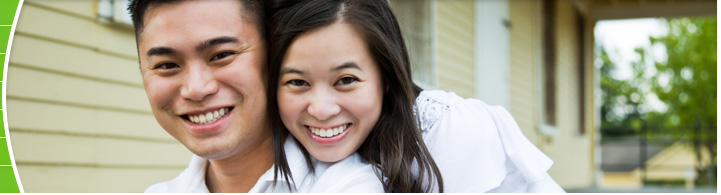 photo of couple on front porch of house